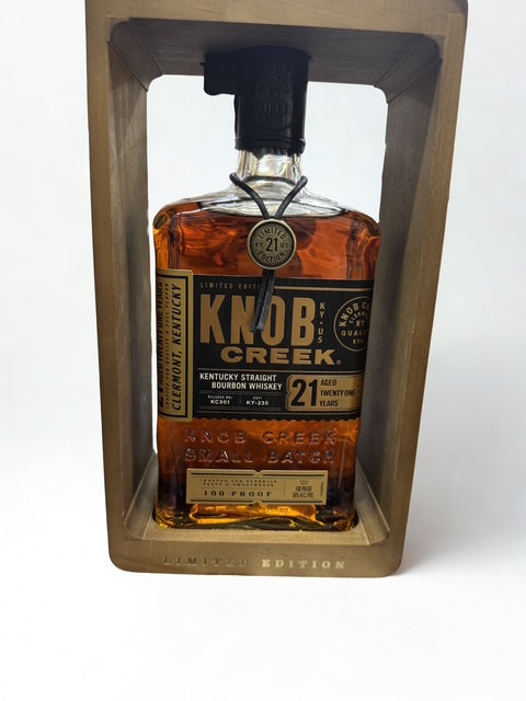 A bottle of Knob Creek 21 Years bourbon whiskey from Campbell Wines, with dark amber liquid and classic label.