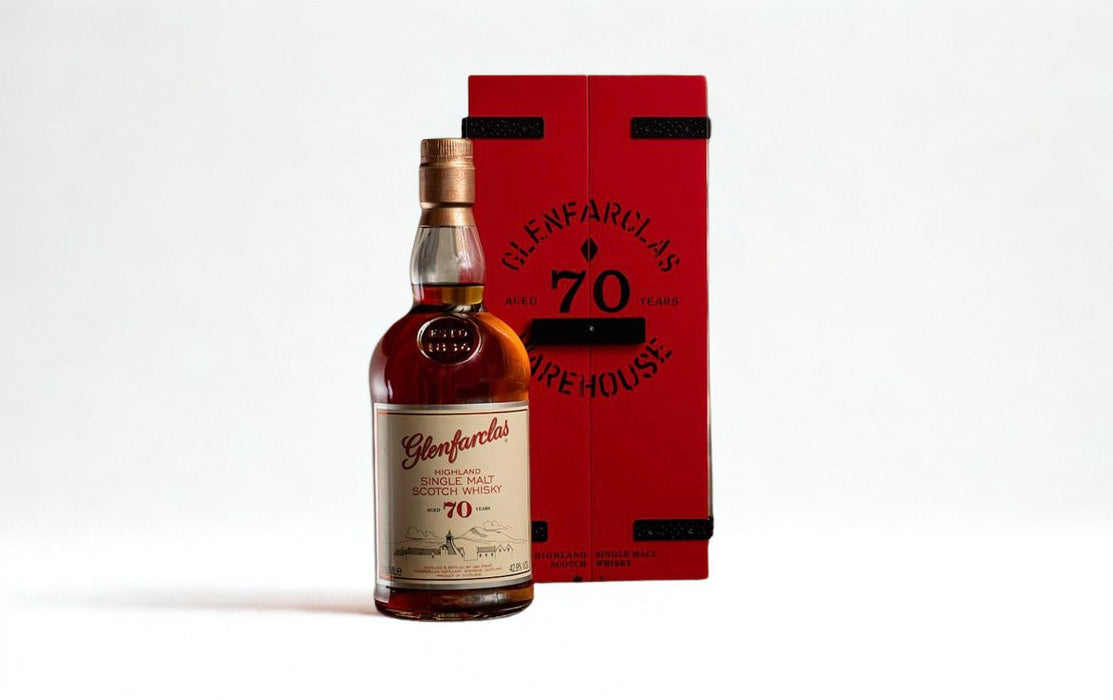 Glenfarclas 70 Year Old whisky bottle with red box packaging, showcasing premium aged Scotch.